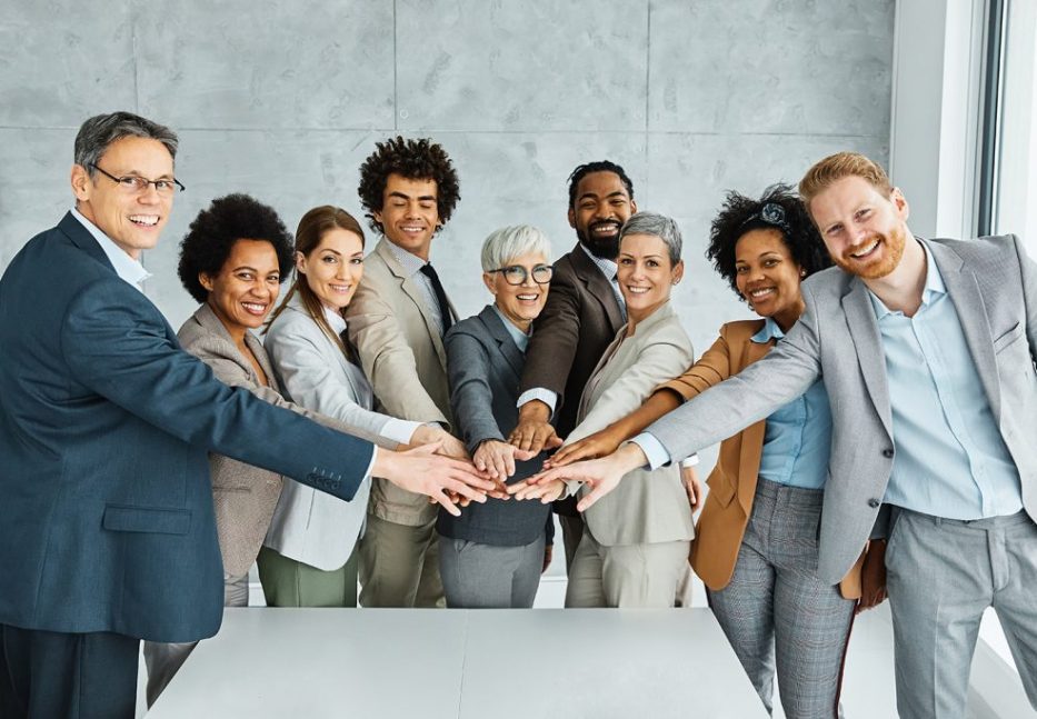 young business people meeting office portrait diversity teamwork group connection success holding hands unity senior mature colleague together